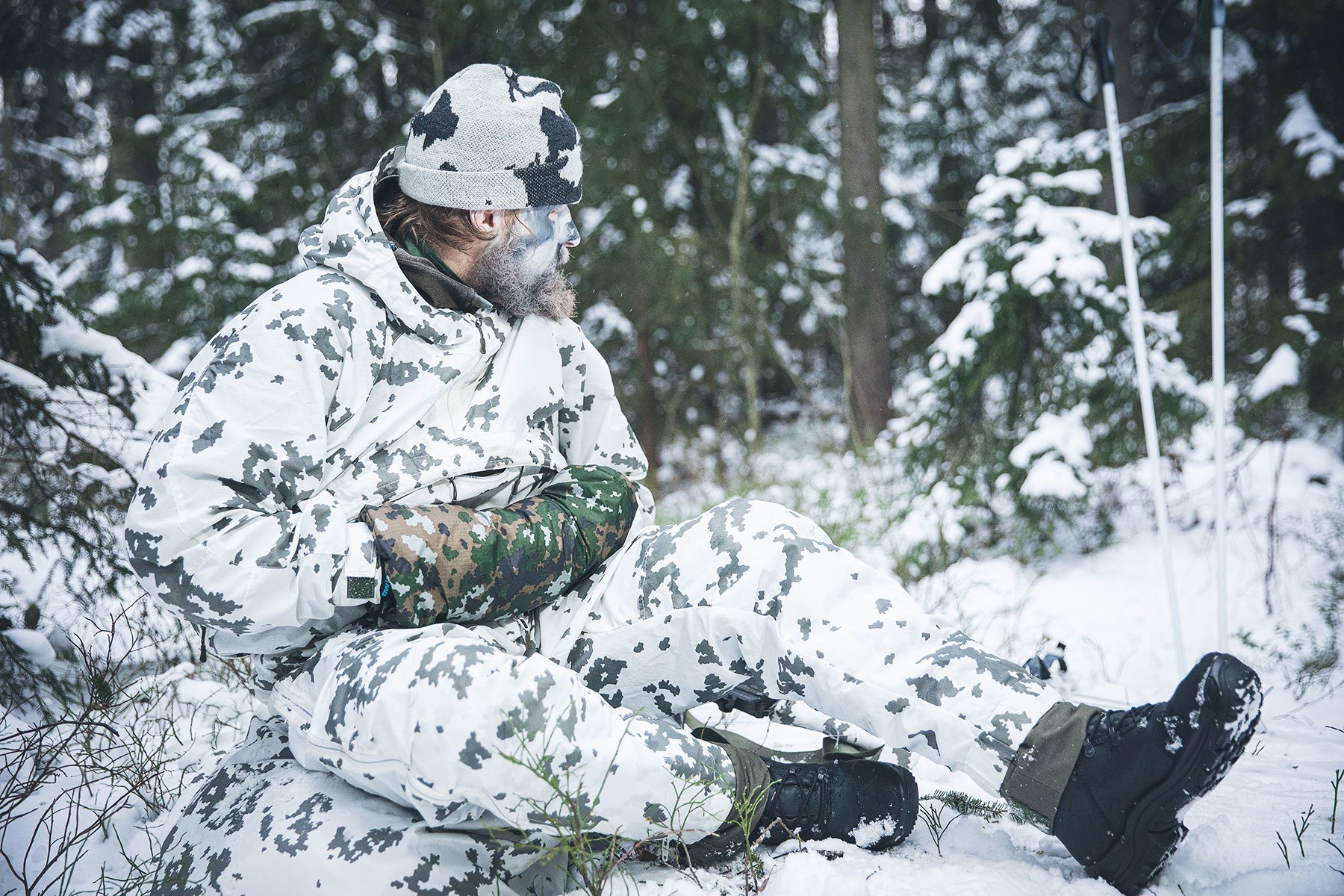 L7 snow camo soldier taking a break