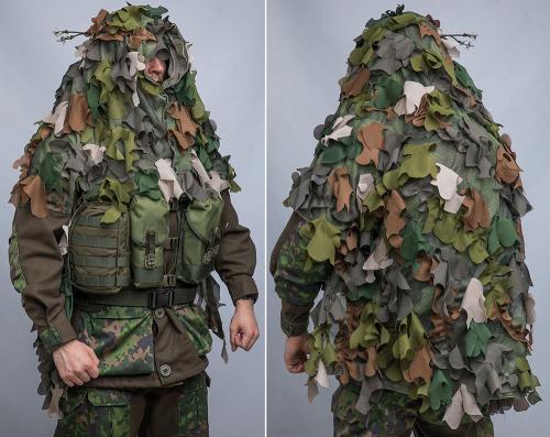 Snigel Ghillie Cloak 14. The cloak fits over a medium sized backpack and does not interfere with combat vest pouches.