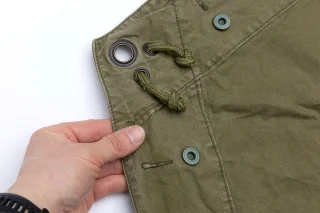 Grommets (16 mm) in the corners. The piece of cord meant for the pegs is sometimes missing. If you can't figure out a solution for this, you probably shouldn't go camping anyway.