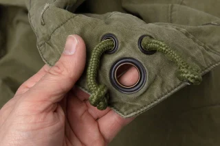 Grommets on the corners. The piece of cord meant for the pegs is sometimes missing. If you can't figure out a solution for this, you probably shouldn't go camping anyway.