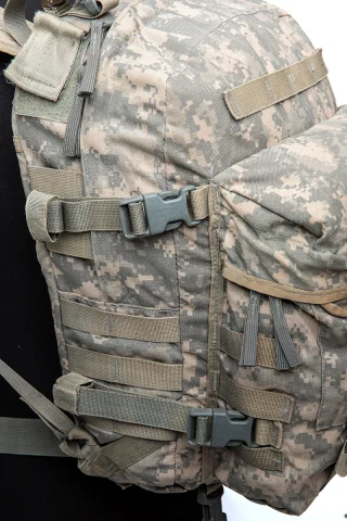 Compression straps for flattening the pack to size and to secure the zipper of the main compartment.