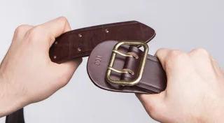 Pictured is the older model belt. The new ones have a bit more dull finish.