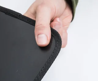 The webbing finished edges protect the backpack from the possibly sharp cut edges of the plastic sheet.