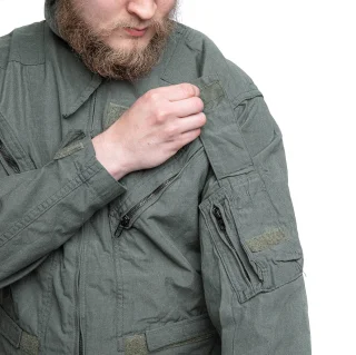 Pen pocket with flap and a small zipper pocket on the sleeve.