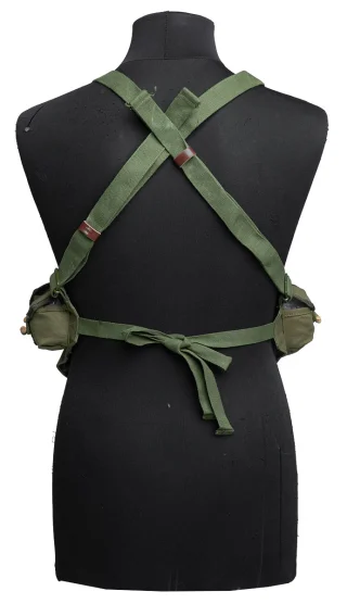The adjustable shoulder straps cross each other at the back and the waist belt strings are tied together at the back.