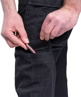 There's a small hook & loop pocket under the left cargo pocket.