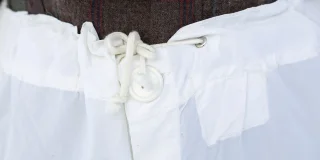 Button fly with drawcord adjustment.