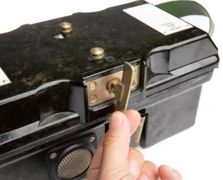 The lid latch mechanism is complicated - but not too much - and bombproof. Literally, probably.