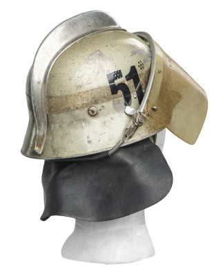 The visor stays on better when the strap is over the neck cover.