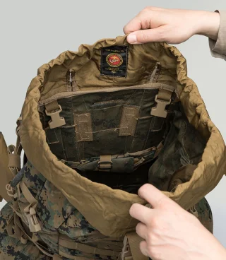 Drawcord closure with reinforcing strap.