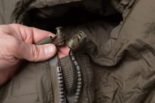 Drawcord closure around the hood