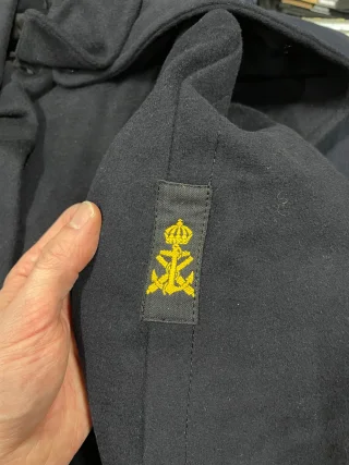 Old badges and patches may be affixed.