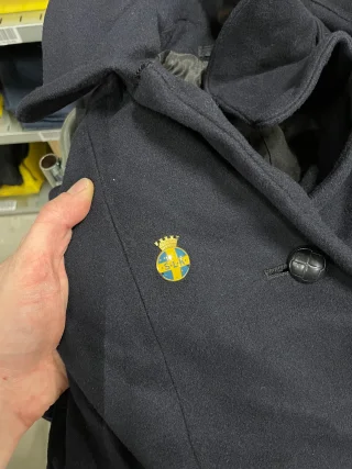 Old badges and patches may be affixed.