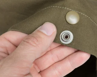 Shelter halves are sold either with buttons or snap fasteners. 