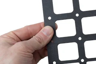 Holes for paracord or bungee cord.