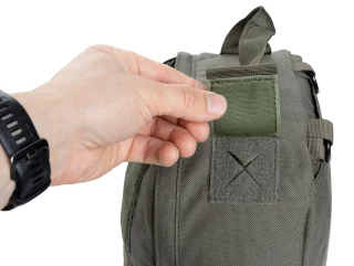 Passage for hydration bladder tube, antennae or cables.