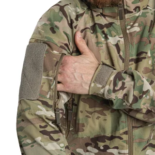 Both sleeves have a zippered pocket and a hook and loop surface for flags and patches.