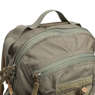 The pack has a carry handle, and some PALS webbing on both sides.