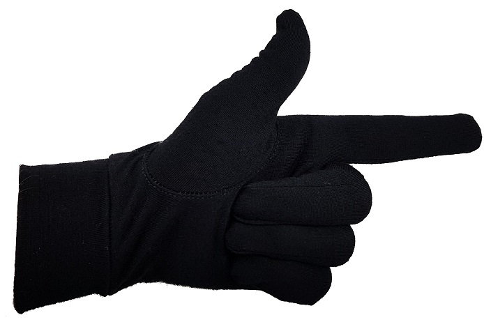 A hand with a black glove on, thumb up and forefinger pointing to right, other fingers in a fist.