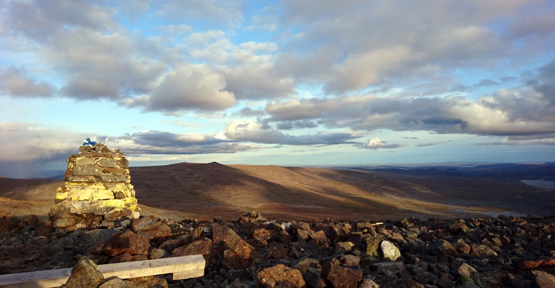 A pile of rocks marking the countries' border on top of the fell.