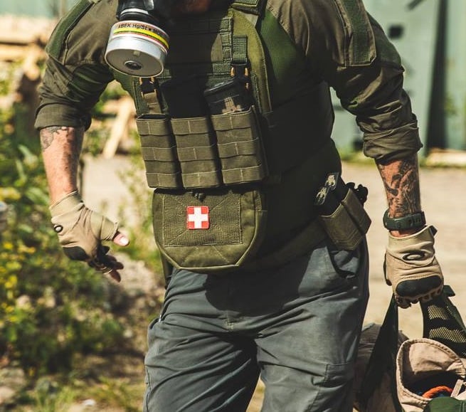 The hanger utility pouch in action attrached to a chest rig and with a medical patch.