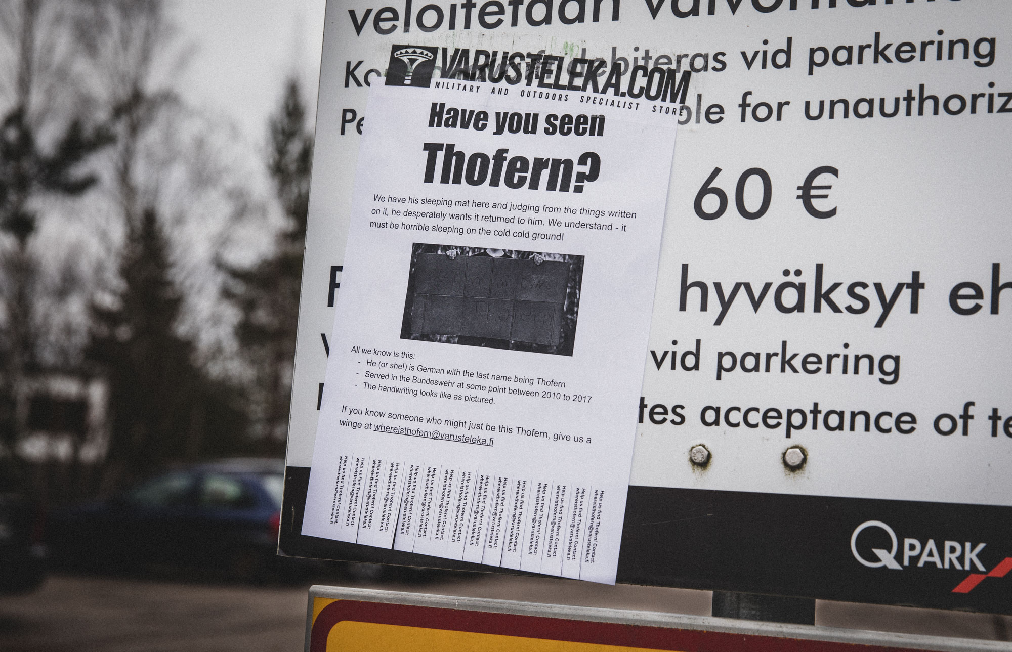 A Have you seen Thofern? ad taped onto a parking sign.