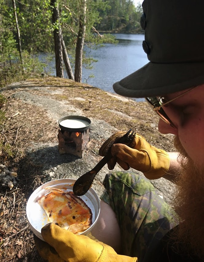 Pancakes with cloudberry jam on a wood gas stove.