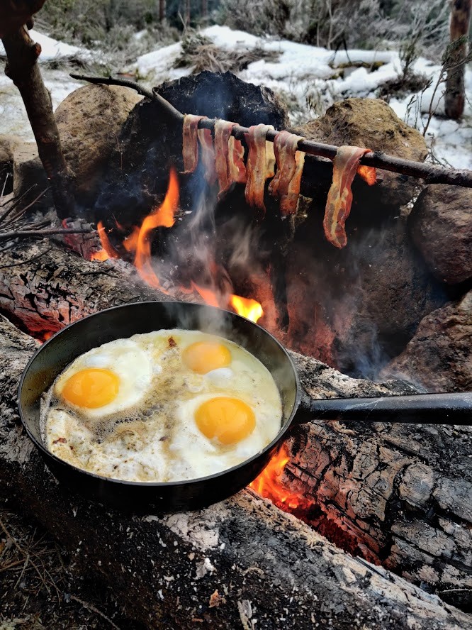 Breakfast eggs and bacon on a stick.