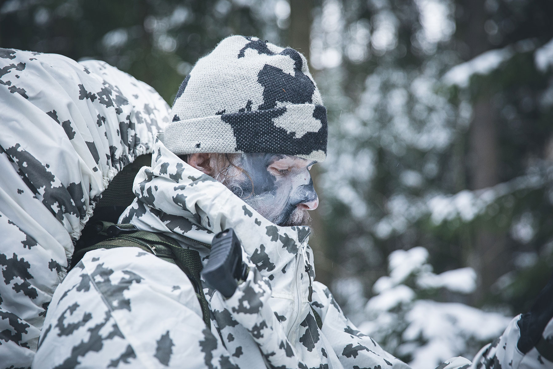 Snow camo paint on soldier's face