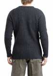 Särmä Merino Wool Sweater. The model in the picture is 175 cm (5’9”) tall, with a 98 cm (38.6”) chest and ja 86 cm (33.9”) waist. He is wearing a size M sweater.