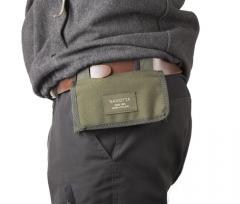 Savotta Rekyyli Cartridge Pouch R10. The pouch can be hung from the belt with its own straps.