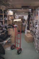 A warehouse corridor full of stuff.