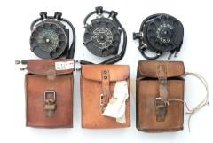 Swedish number scroll for field telephone, with leather case, surplus. Color and condition varies.