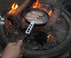 Trangia 27-1HA Camping Stove. Pro-tip: You can use a stick to cleverly lengthen the Trangia handle, no more burnt fingers when frying on a fire!