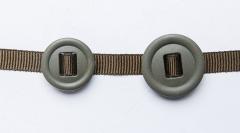 2M Slotted button, 10-Pack. 25 and 30 mm 2M slotted buttons threaded onto the 10 mm button ribbon.