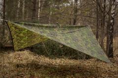Särmä TST Tarp, M05 woodland camo. 290 x 290 cm pitched "diamond style". Old model in picture; the new model has 17 webbing loops.