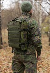 Särmä TST Tarp, M05 woodland camo. 290 x 290 cm strapped onto the side of a combat pack.