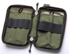 Särmä TST Organizer pocket. Flat Cordura-pockets and tie-down loops on both sides, four pen loops on the left and two tool loops on the right.