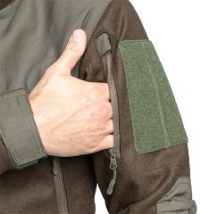 Särmä TST Woolshell Jacket. Upper arm zippered pockets with loop for patches on top. The Green-Brown color is discontinued.