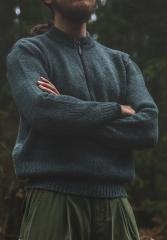 A grey sweater with zipper on a man.