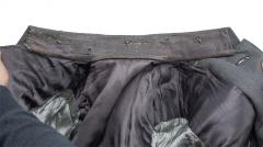 Finnish artillery officer M36 uniform with breeches. There's a lot of wear on the collar area.