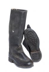 Soviet Kirza boots, surplus. We got a couple of WW2 style dimple soled boots too.
