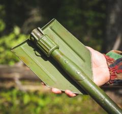 Danish M-1943 Style E-tool, Surplus. The shovel head can be folded for transportation. The shaft cannot unless you're the Hulk.