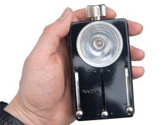 NVA Flashlight, "NARVA", Surplus. The knob at the top turns the light on/off.