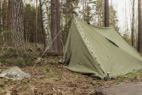 Norwegian Rhombus Shelter Quarter, Olive Drab, Surplus. Pictured here is the 4-person tent erected wrong. Poles, ropes and pegs not included.
