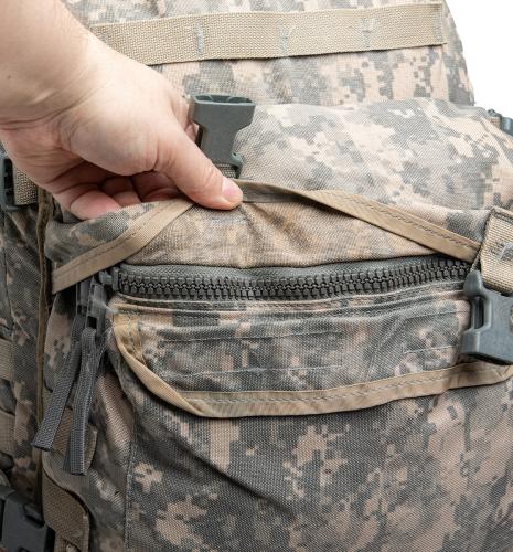 US MOLLE II Assault Pack, Surplus. The front pocket with a protected zipper closure.