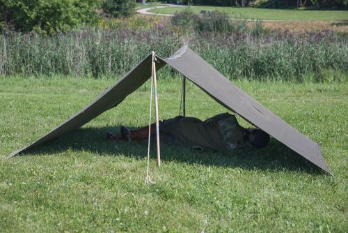 NVA shelter half, Strichtarn, surplus. Two tent halves buttoned together. There's well enough room for two people inside.