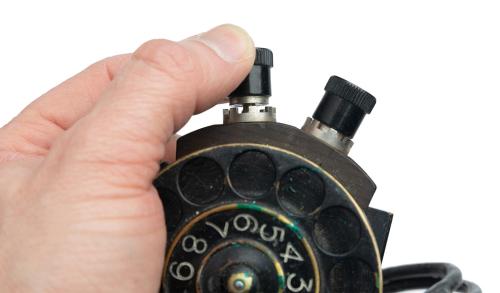 Swedish number scroll for field telephone, with leather case, surplus. 