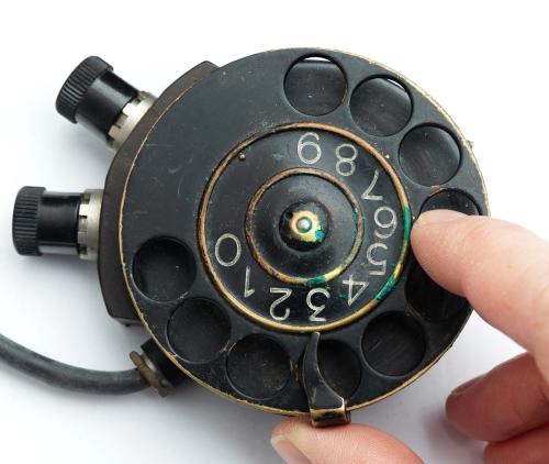 Swedish number scroll for field telephone, with leather case, surplus.