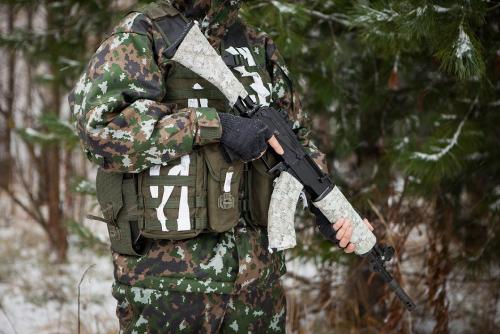 Gear Aid Camo Form Camouflage Wrap. Snow wrap on the vest, reversed Digital Woodland on the rifle.